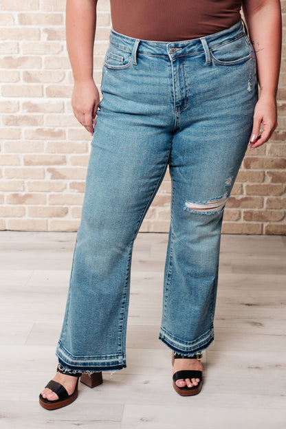 Judy Blue • Isla • Mid Rise Distressed Released Hem Bootcut Jeans