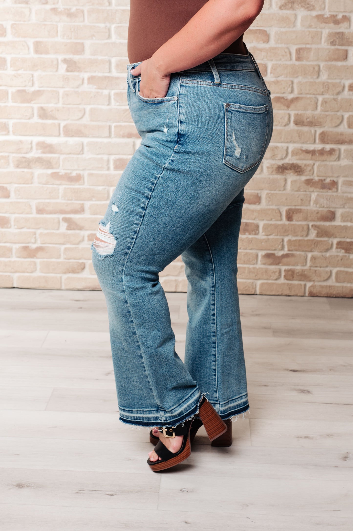 Judy Blue • Isla • Mid Rise Distressed Released Hem Bootcut Jeans