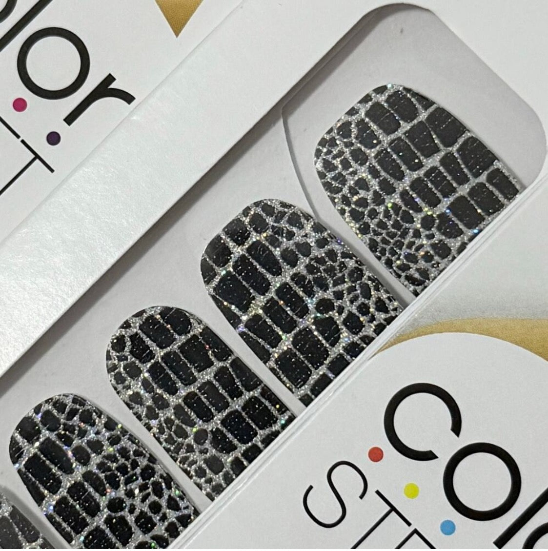 Color Street nail strips in black and white geometric pattern design called Hiss and Make Up