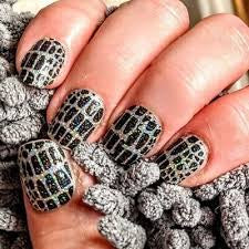 Color Street nail strips in black and white geometric pattern design called Hiss and Make Up