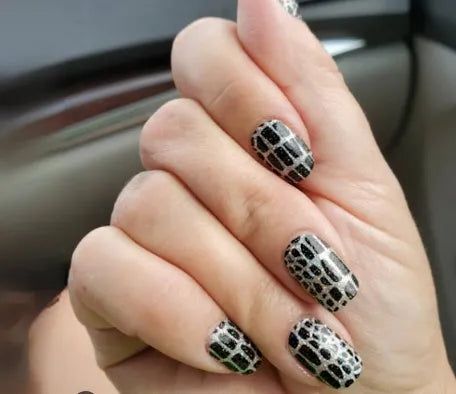 Color Street nail strips in black and white geometric pattern design called Hiss and Make Up