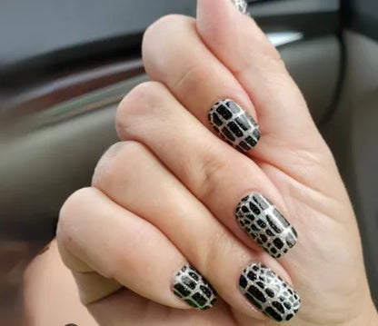 Color Street nail strips in black and white geometric pattern design called Hiss and Make Up